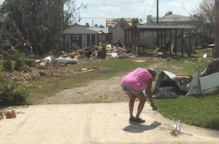 This is the way most everything looked. This woman seemed to be in shock – she walked past the piles of debris to pick up a single bottle of trash.